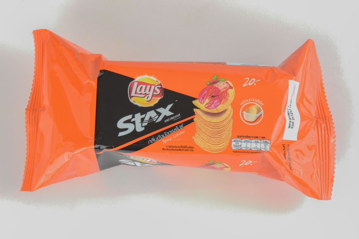 This is an orange-coloured package of Lays Stax potato chips with a picture of a lobster on it.