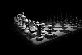 This is a black and white photograph of a chessboard.