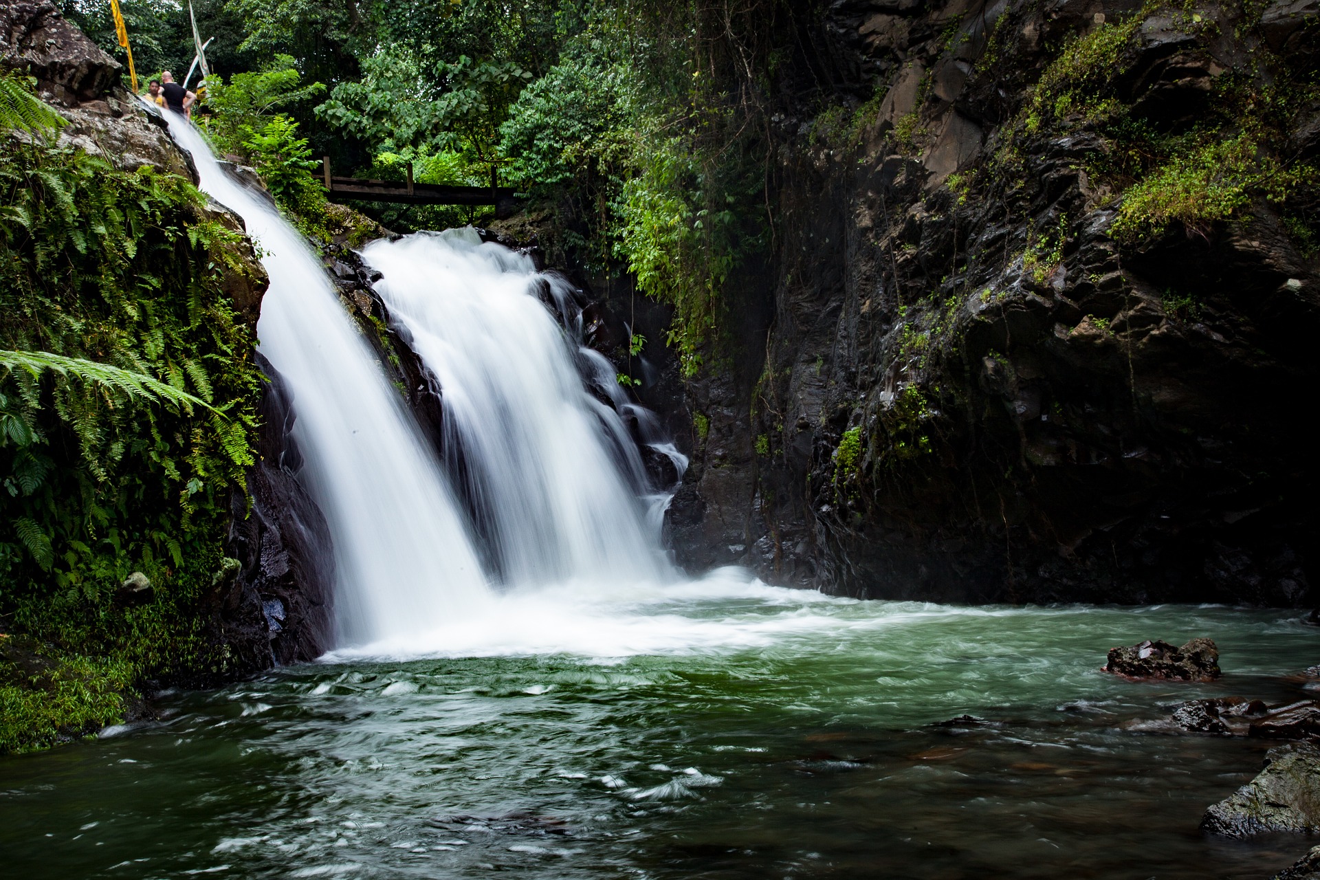 This is a photograph of a waterfall in the jungle.