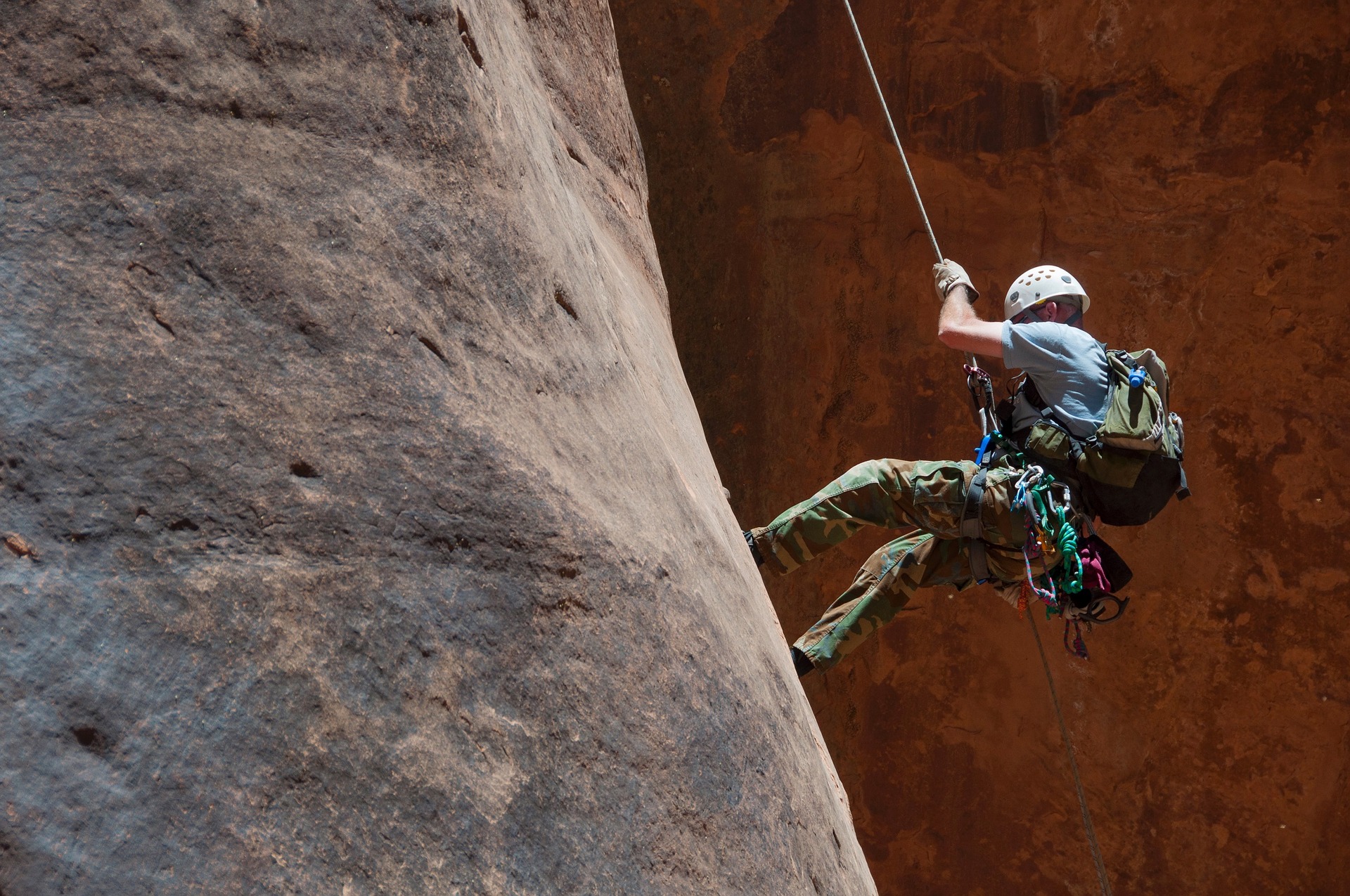This is a photograph of a climber on a rock face.