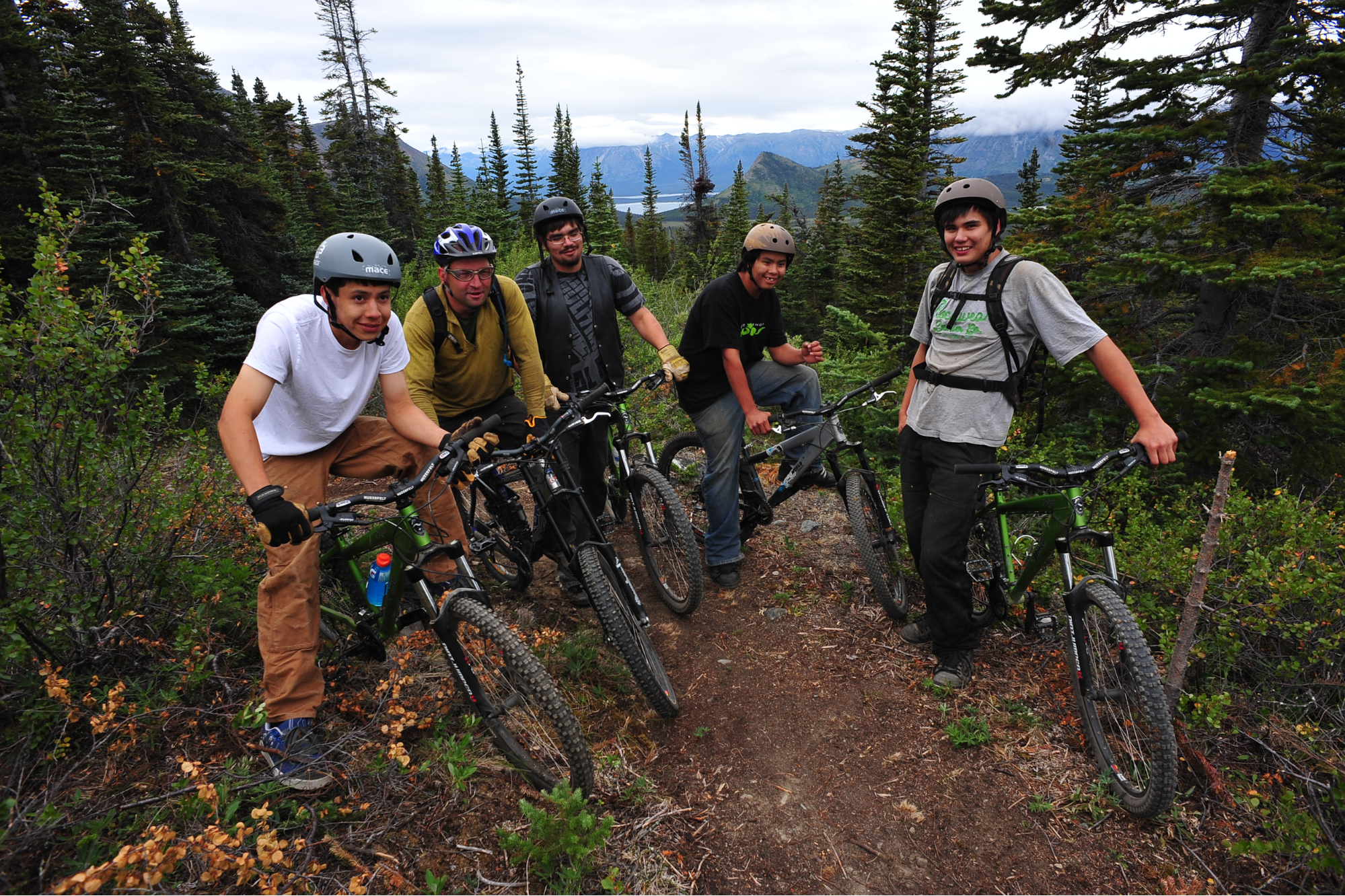 This is a photograph of one of the trail crews enjoying a ride down the trails that they built and maintain.