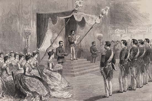 In this painting, a group of men, in military dress, stand at attention in front of the emperor. The emperor is on a raised dais, and he is proclaiming the Constitution itself. To his right, a group of women dressed in western clothing look on. 