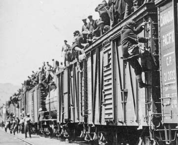 This photo shows strikers from unemployment relief camps established by the federal government in British Columbia and Ontario on their way to Ottawa to complain about camp conditions, 1935. Their journey was stopped in Regina.