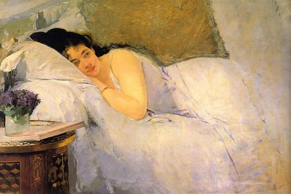 This is an impressionist painting by artist Eva Gonzales from 1876 entitled ‘Woman Awakening.'