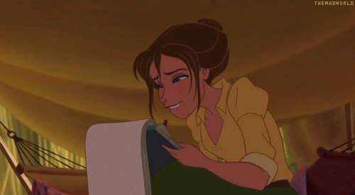 This is a cartoon version of a young woman with a note pad and pen in her hands, looking confused for a moment and then gets a burst of inspiration. A smile breaks across her face and she begins to write.