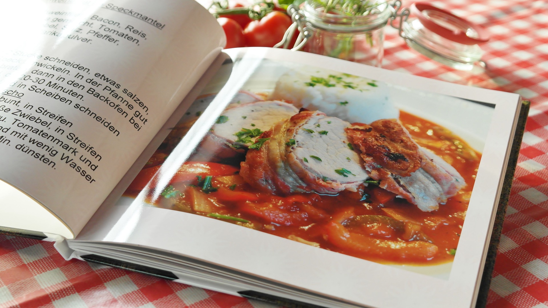 This is an image of a cookbook turned open to a page showing how to make manicotti.