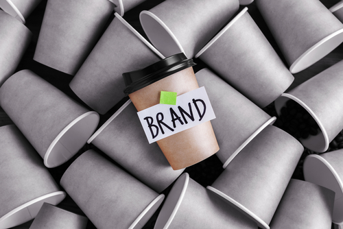 This is an image of a coffee cup with the word Brand on it.