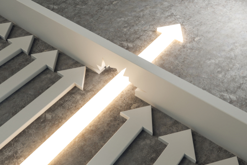 This is an image of a directional arrow breaking through a barrier.