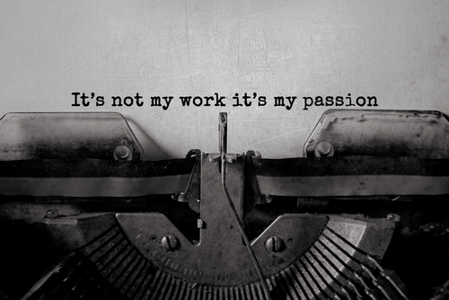 This is an image of a typewriter with words on the page that read it's not my work, it's my passion.