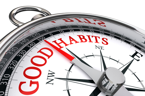 This is an image of a compass with the needle pointing to the words good habits.