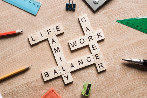This is an image of a series of wooden blocks spelling out the word life, family, balance, work, career.