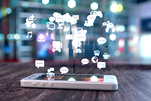 This is an image of a cell phone with a representation of data floating out.