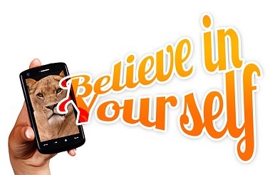 A hand is holding a cellphone where a lion says Believe in yourself.