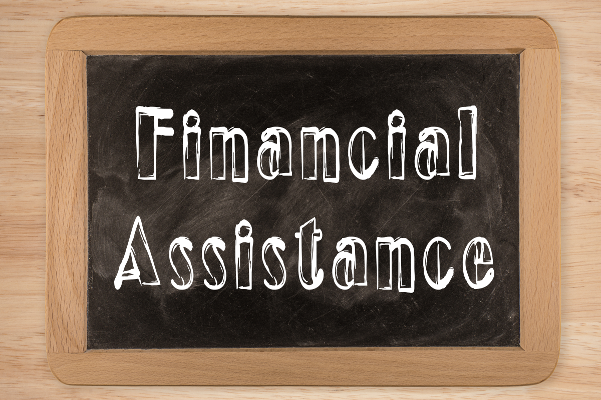 This graphic shows the words financial assistance written on a chalkboard.