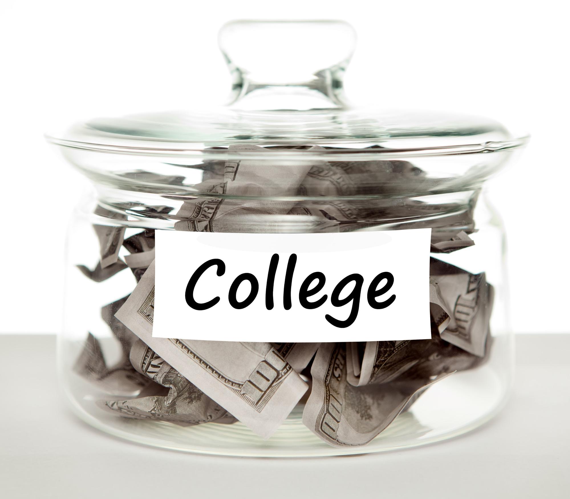 This is an image of a side view of glass jar filled with hundred dollar bills. The jar is labelled &lsquo;college.