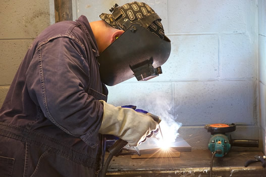 This is an image of a welder completing a small weld job.