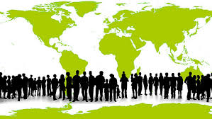 This is an illustration of the outline of a world map with a line of human silhouettes in the foreground.