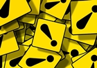 This is a collage of yellow signs with bleck exclamation signs on them.