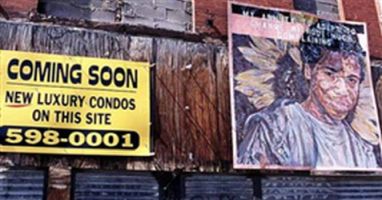 This is a photo of a building with bricked up windows and a sign saying 'Coming soon new luxury condos on this site' along with a phone number.