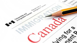 This is a photograph of a piece of paper with the Canadian Citizenship and Immigration logo on it.