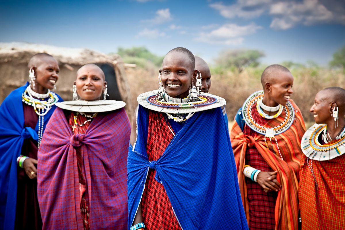 This is an image of Maasai women wearing traditional ornaments around their necks.