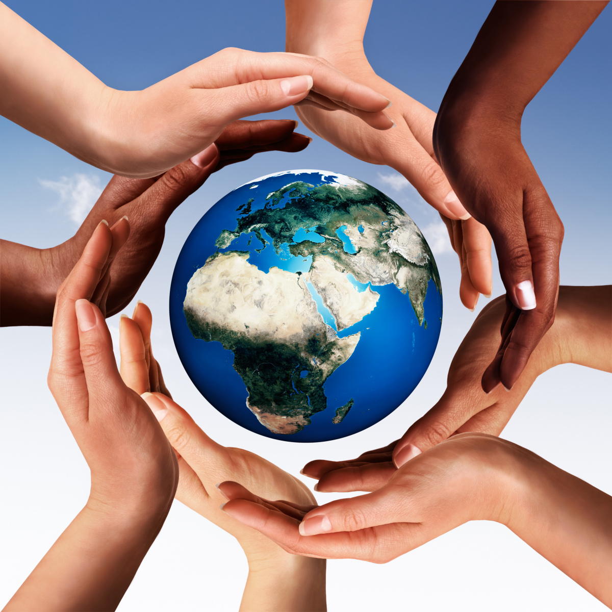 This is an image of eight multicultural hands circling a picture of the earth.