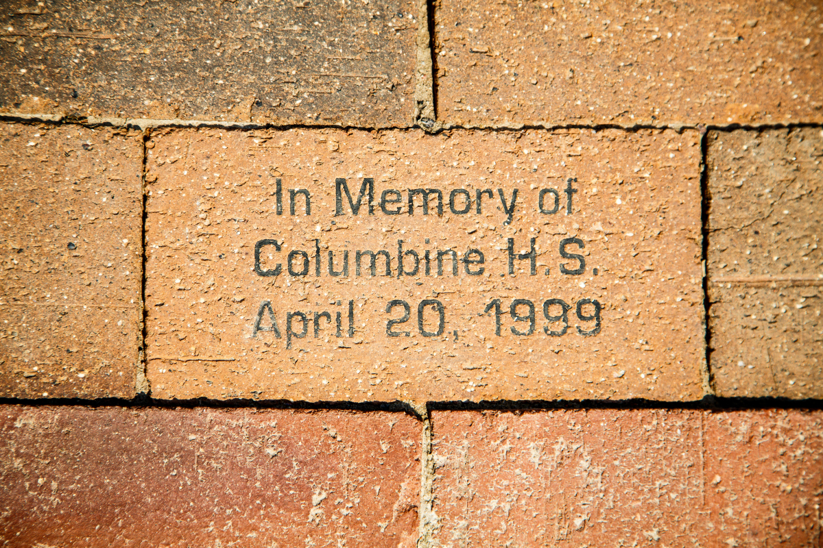 This is an image of a brick wall with an inscription that says in memory of Columbine HS, April 20, 1999.