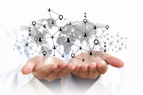 In this picture, two hands are held open.  From one hand to the other spans a web of connected icons of people.  It demonstra
