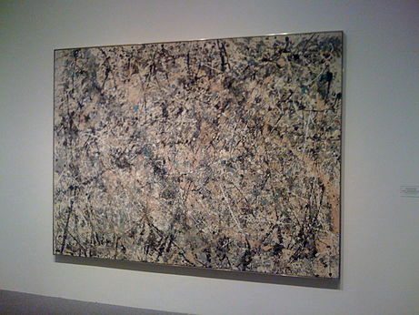 This is an image of a painting by Jackson Pollock that features swirls and drips of paint on a canvas.
