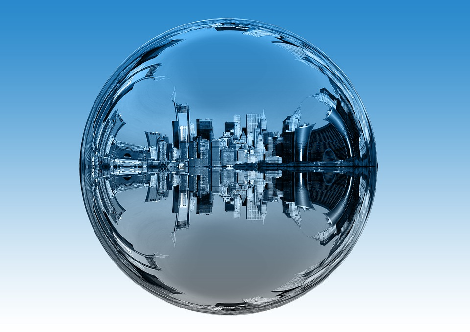 This is an image of futuristic city in a mirrored orb.