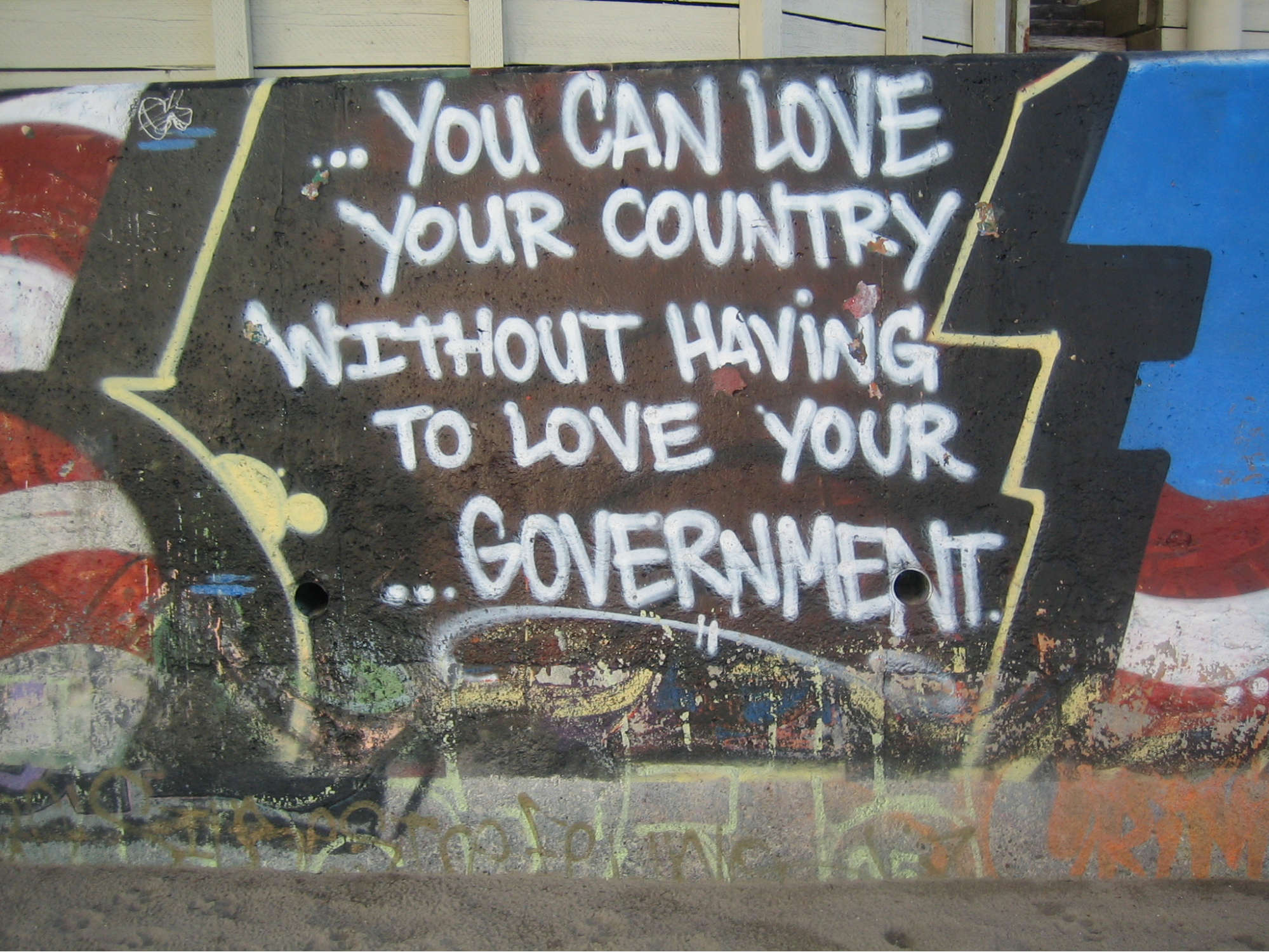 This is an image of graffiti that states, “You can love your country without having to love your government.” 