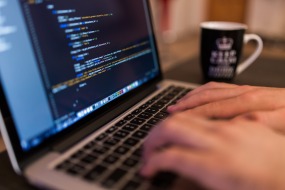 An image of a programmer working on a computer.