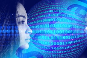 An image of a male and a female gazing at each other as binary code floats between them.