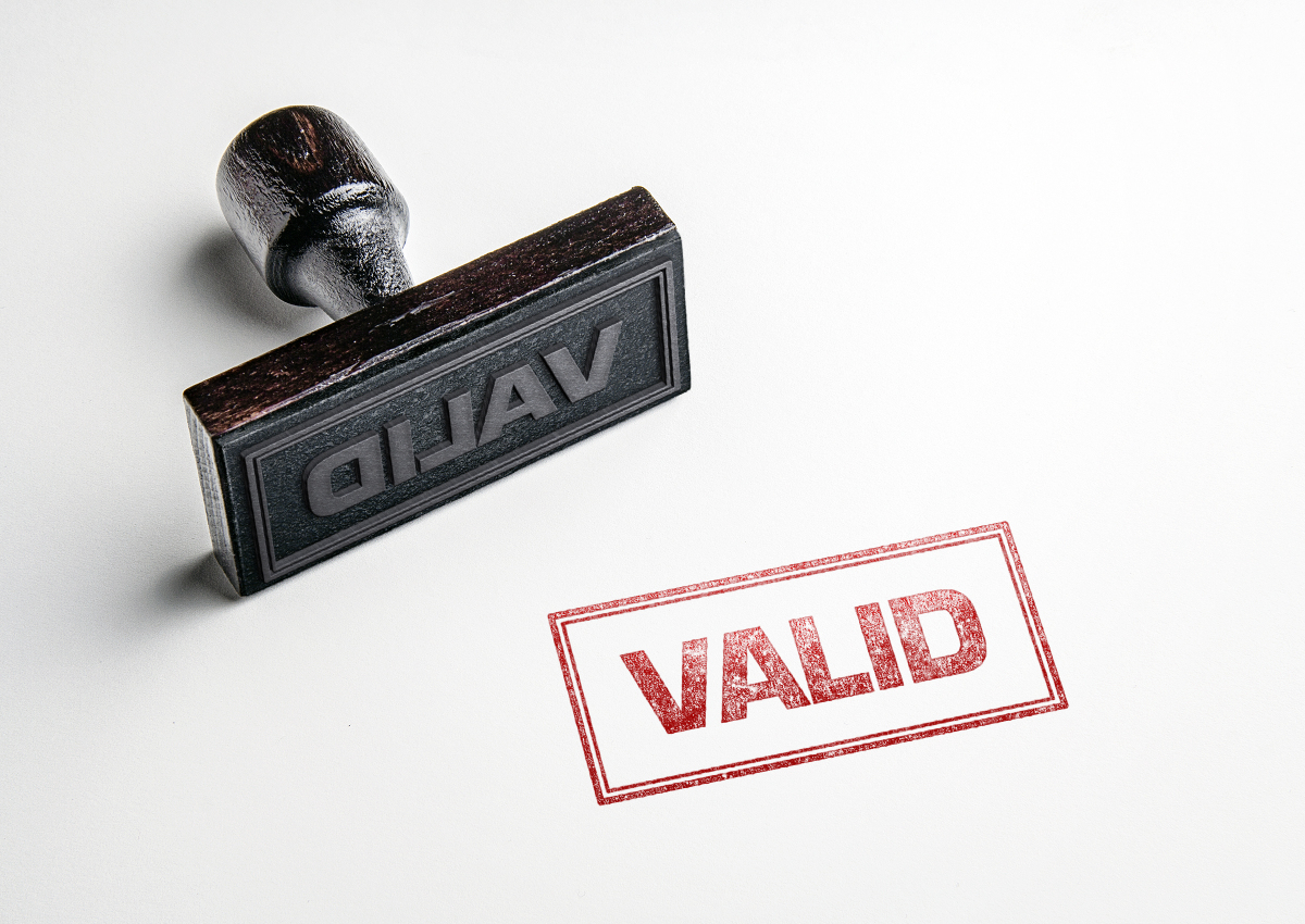 This is an image of a rubber stamp that has just stamped the word 'valid.'