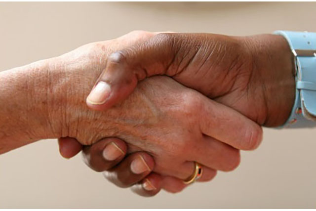 This is an image of two people shaking hands.