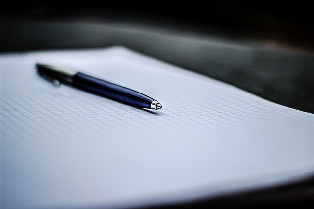 This is an image of a notepad and a piece of paper.