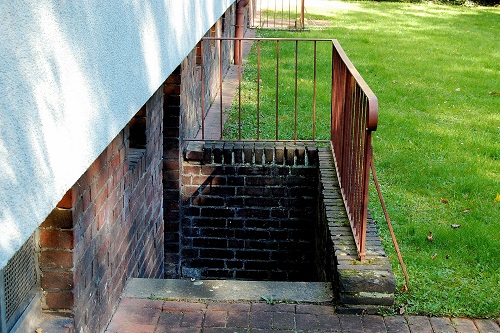 Image of a staircase leading from outside the apartment at the side of the building.