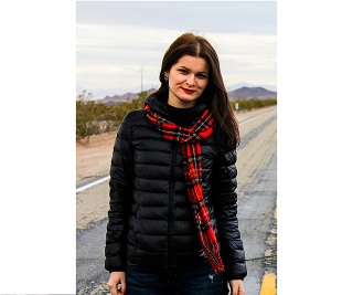 An image of woman standing outside.