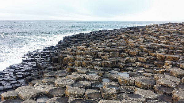 An image of Giant's Causeway in Ireland where rocks are shaped like hexagons.