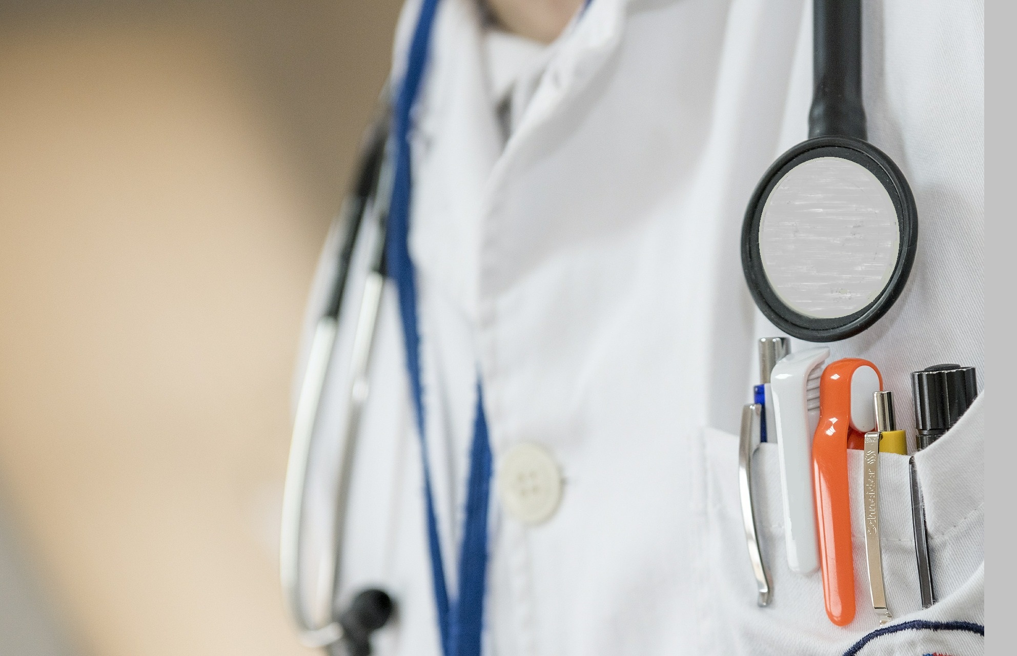 An image of a doctor with a stethoscope around their neck.