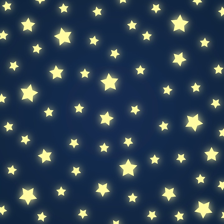  This is an image of a navy blue background with many different-sized stars glowing in the dark.