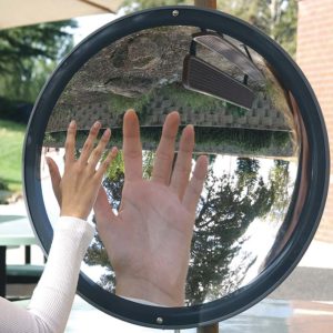 This is an image of a hand held up in front of a converging mirror. Its reflection is larger than the hand itself, but with the same orientation.