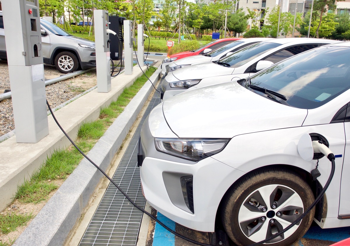  This image depicts an electric car charging station. 