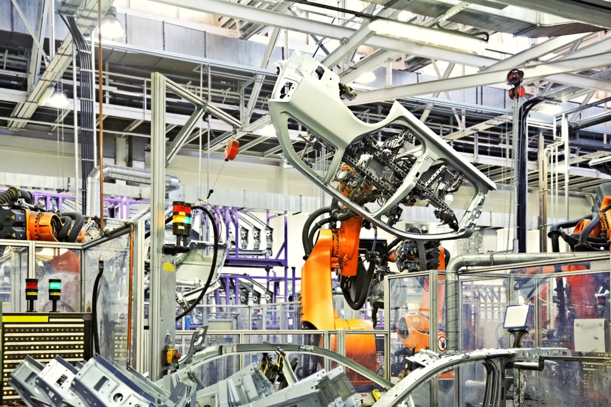 This image depicts a robot in an automobile assembly plant.