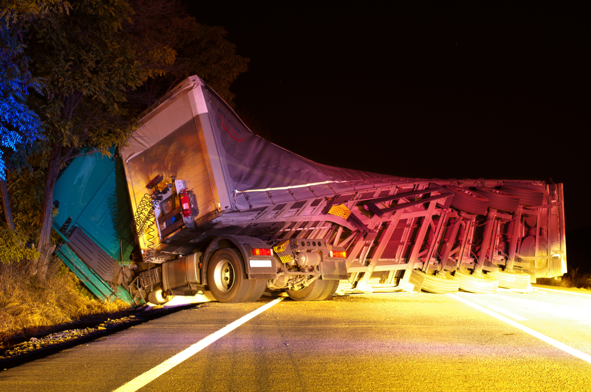 This image depicts a truck that has rolled over. 