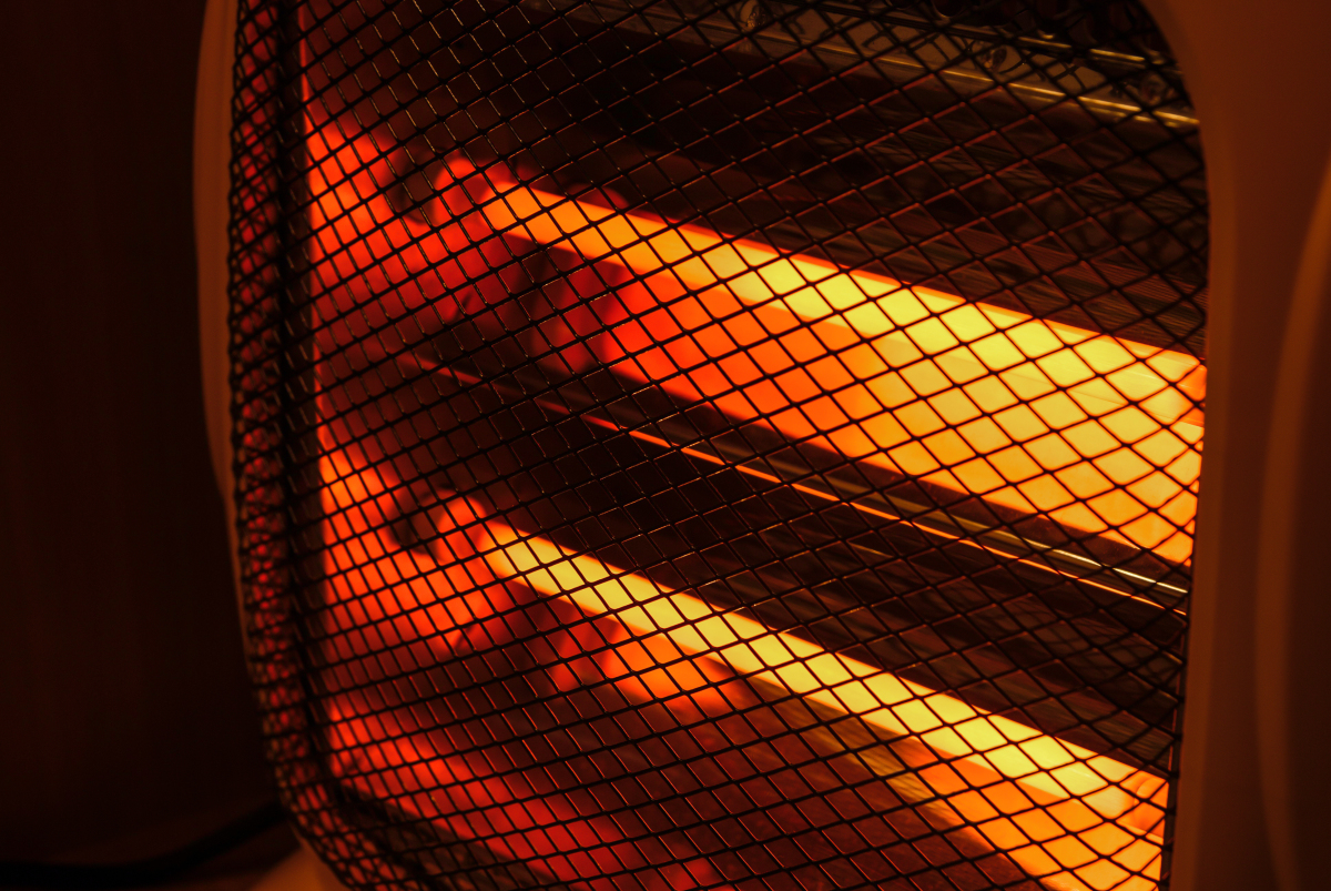 This image depicts an electric heater with glowing elements.