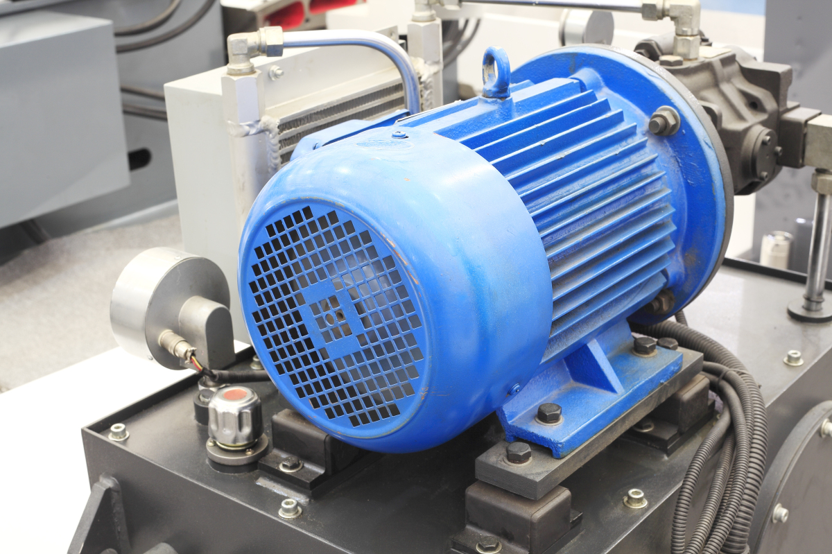 This image depicts an electric motor driving a piece of industrial equipment. 
